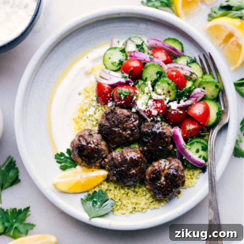 Mediterranean Meatball Bowls 9 Overhead image of beautifully assembled Greek Meatball Bowls, ready to be enjoyed, highlighting the freshness and vibrancy of the meal.