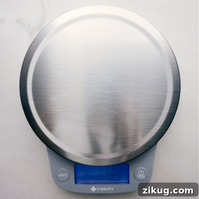 A digital food scale with a bowl, emphasizing precise weight measurements for baking and cooking accuracy.