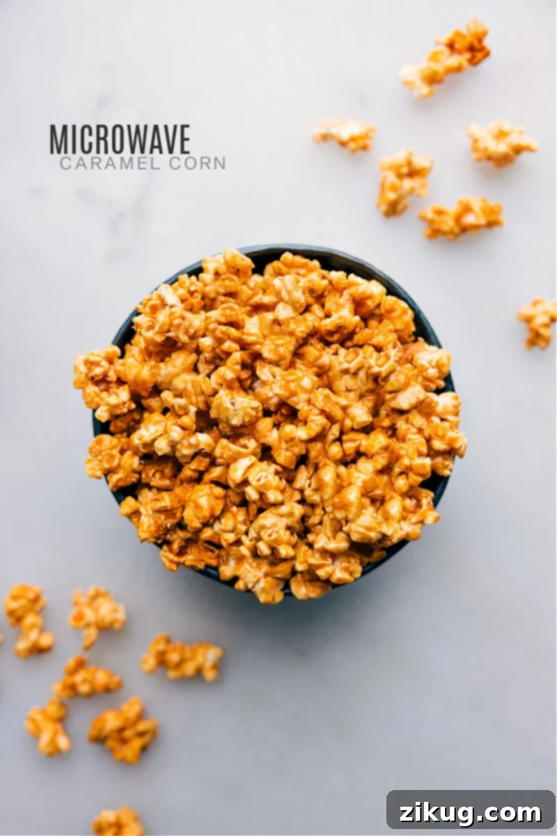 Make caramel corn the quick and easy way. Skip watching the stove for precise temperatures–instead, make this treat in the microwave oven! Quick and Easy Microwave Caramel Corn is a delicious shortcut that yields the salty-sweet treat we all crave! Recipe via chelseasmessyapron.com #dessert #quick #easy #simple #familyfriendly #movienight #treats #microwave #caramelcorn Overhead image of freshly made Microwave Caramel Corn in a bowl, ready to be enjoyed.