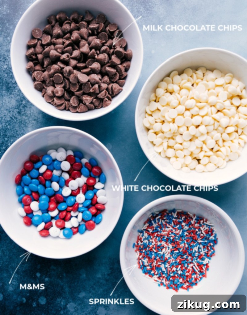 This 4th of July Bark Recipe is the perfect patriotic treat! Recipe via ChelseasMessyApron #festive #chocolate #whitechocolate #m&ms #sprinkles #dessert #treat #fourthofjuly #bark Ingredients for 4th of July Bark, including milk chocolate chips, white chocolate chips, red, white, and blue M&Ms, and festive sprinkles.