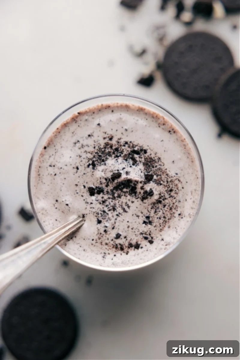 Oreo Milkshake Close-up Close-up overhead view of the irresistible Oreo milkshake with whipped cream and crushed cookies.