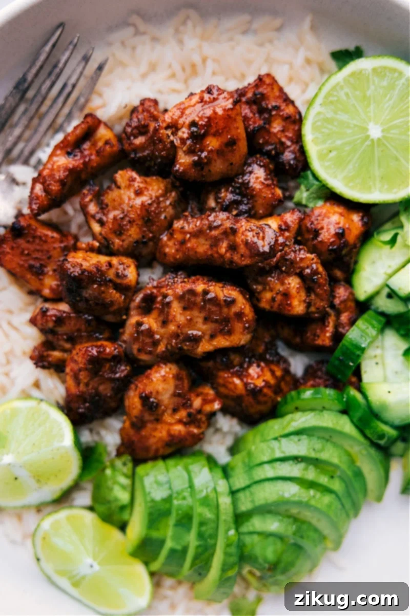 Overhead image of the finished Chipotle Chicken dish ready to be enjoyed, served with fresh lime wedges and cilantro.