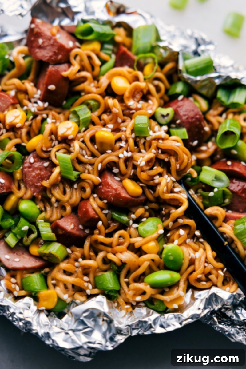 Delicious and Convenient: Perfectly Cooked Foil Pack Ramen Noodles Ready for Any Occasion Close-up overhead shot of cooked Foil Pack Ramen Noodles, elegantly garnished and ready to be enjoyed straight from the packet