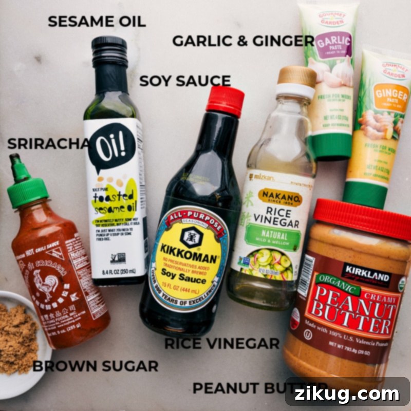 Close-up shot of the sauce ingredients for Peanut Butter Ramen, including peanut butter, soy sauce, rice vinegar, sesame oil, ginger paste, garlic paste, brown sugar, and sriracha.