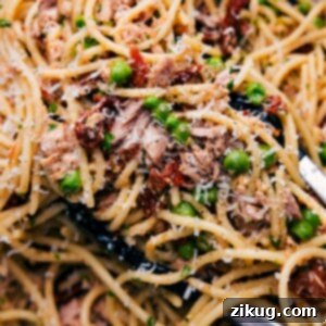 Wholesome Tuna Pasta Delight 2 A bowl of healthy tuna pasta, freshly prepared and topped with grated cheese, inviting a savory and nutritious meal experience.
