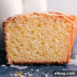 Beautifully glazed slice of homemade lemon bread, ready to serve.