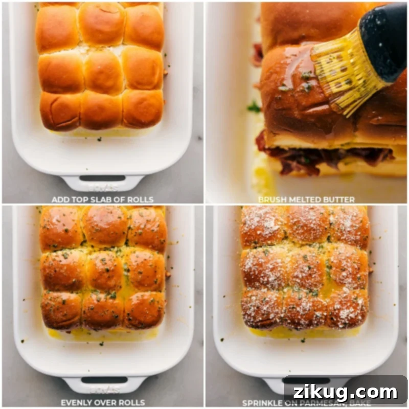 These BBQ Chicken Sliders combine juicy BBQ chicken, melty Gouda cheese, and sweet Hawaiian rolls, all jazzed up with a pop of onion and cilantro. The rolls are brushed with garlic-herb butter that gives these sliders a beautiful crispy and golden exterior. Recipe via ChelseasMessyApron.com #BBQ #BBQchicken #sliders #hawaiianrolls #quick #easy Fully baked and golden-brown BBQ Chicken Sliders with Parmesan, ready to serve