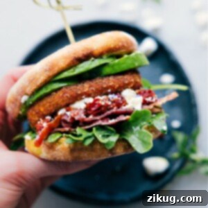 A close-up image of the completed English Muffin Sandwich, sliced in half, revealing its vibrant layers of ingredients.