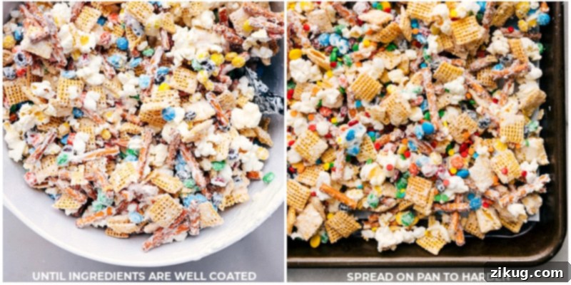The Popcorn Snack Mix is now spread out on a sheet pan, ready to cool and harden. This delightful blend of popcorn, pretzels, Chex cereal, and mini M&M's coated in creamy white chocolate and sprinkles is an irresistible no-bake treat from chelseasmessyapron. Process shot of Popcorn Snack Mix spread evenly on a sheet pan to cool and harden.