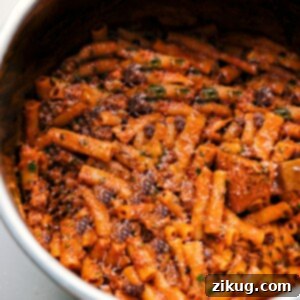Cheesy Instant Pot Baked Ziti 3 A delicious bowl of Instant Pot Baked Ziti, garnished with fresh basil.