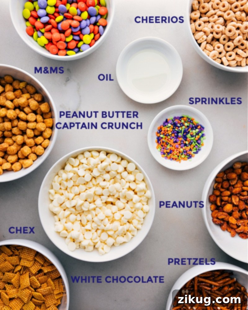 All the ingredients in this recipe prepped out for easy assembly including the cereals, oil, sprinkles, peanuts, and M&Ms.