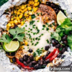 Close-up of a finished Chicken Rice Foil Pack, showcasing the melted cheese and vibrant ingredients.