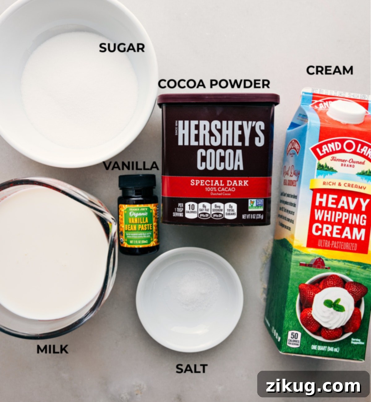 Essential ingredients for crafting Crockpot Hot Chocolate Ingredients laid out for Crockpot Hot Chocolate, featuring cream, cocoa powder, sugar, and other essentials.