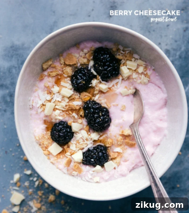 Berry cheesecake variation featuring fresh blackberries, crumbled graham crackers, and chopped white chocolate, reminiscent of a dessert.