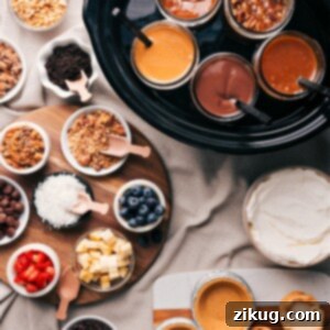 Your Ultimate Dessert Pie Bar Free Printable 2 Various dessert toppings and fillings including glass jars filled with caramel, chocolate, and other sauces, accompanied by bowls of crushed nuts, blueberries, coconut shreds, chocolate chips, and other delectable ingredients for a dessert pie bar.