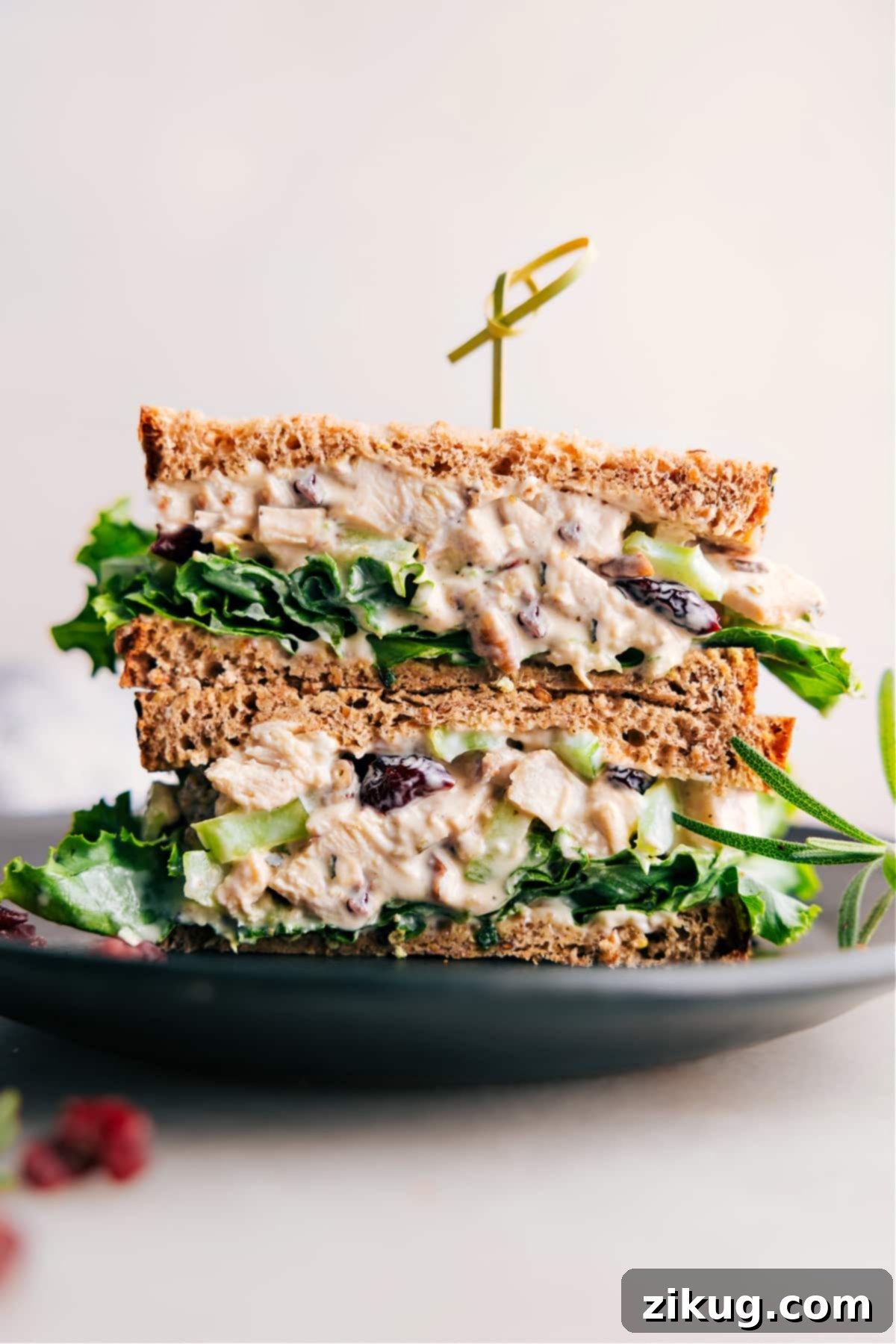 Scrumptious Rosemary Chicken Salad sandwich, halved to reveal its generous, flavorful filling.