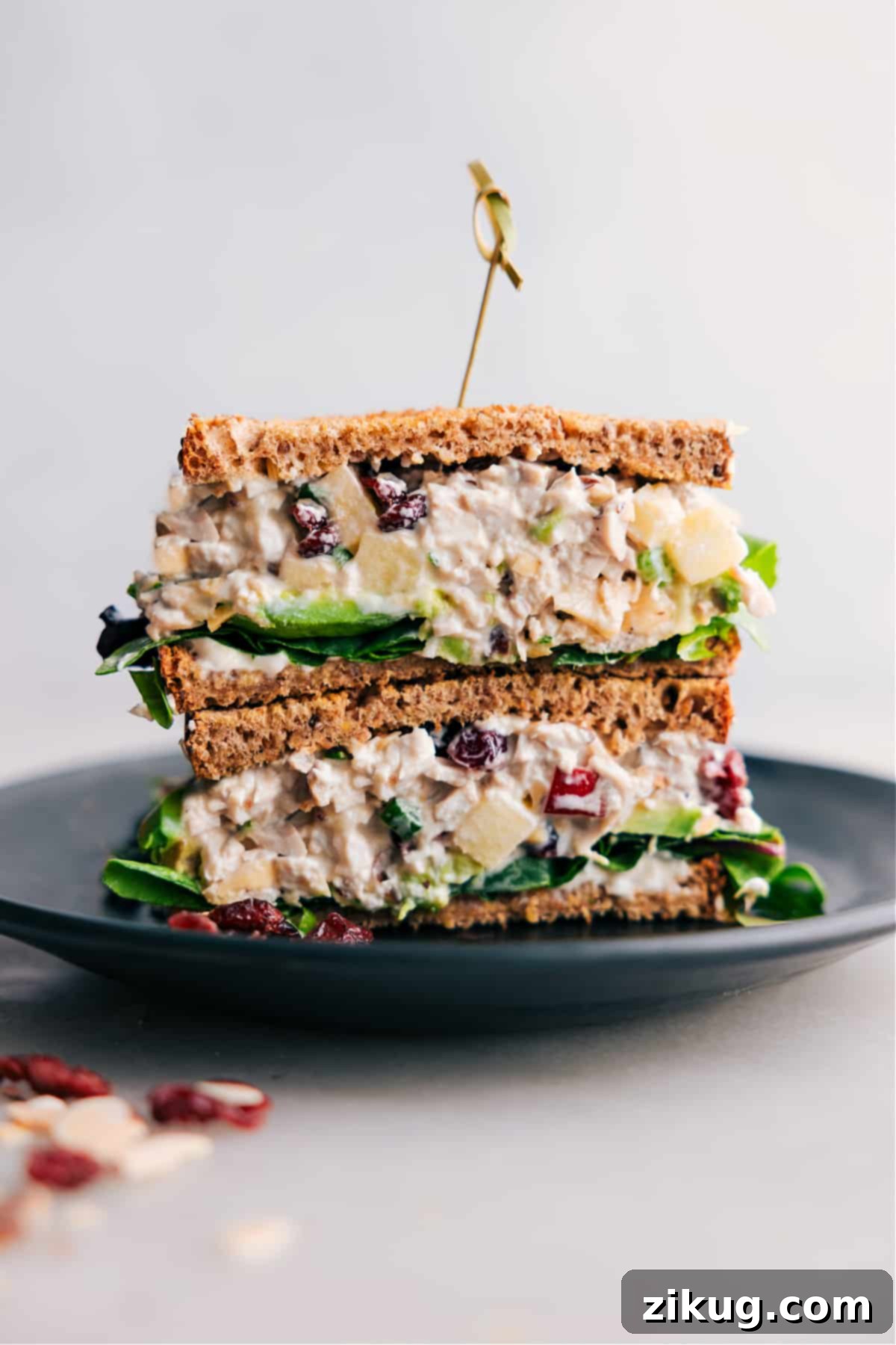 Crisp Apple Chicken Salad Sandwich Recipe Stacked half-cut chicken salad with apples, showcasing the flavorful filling inside.