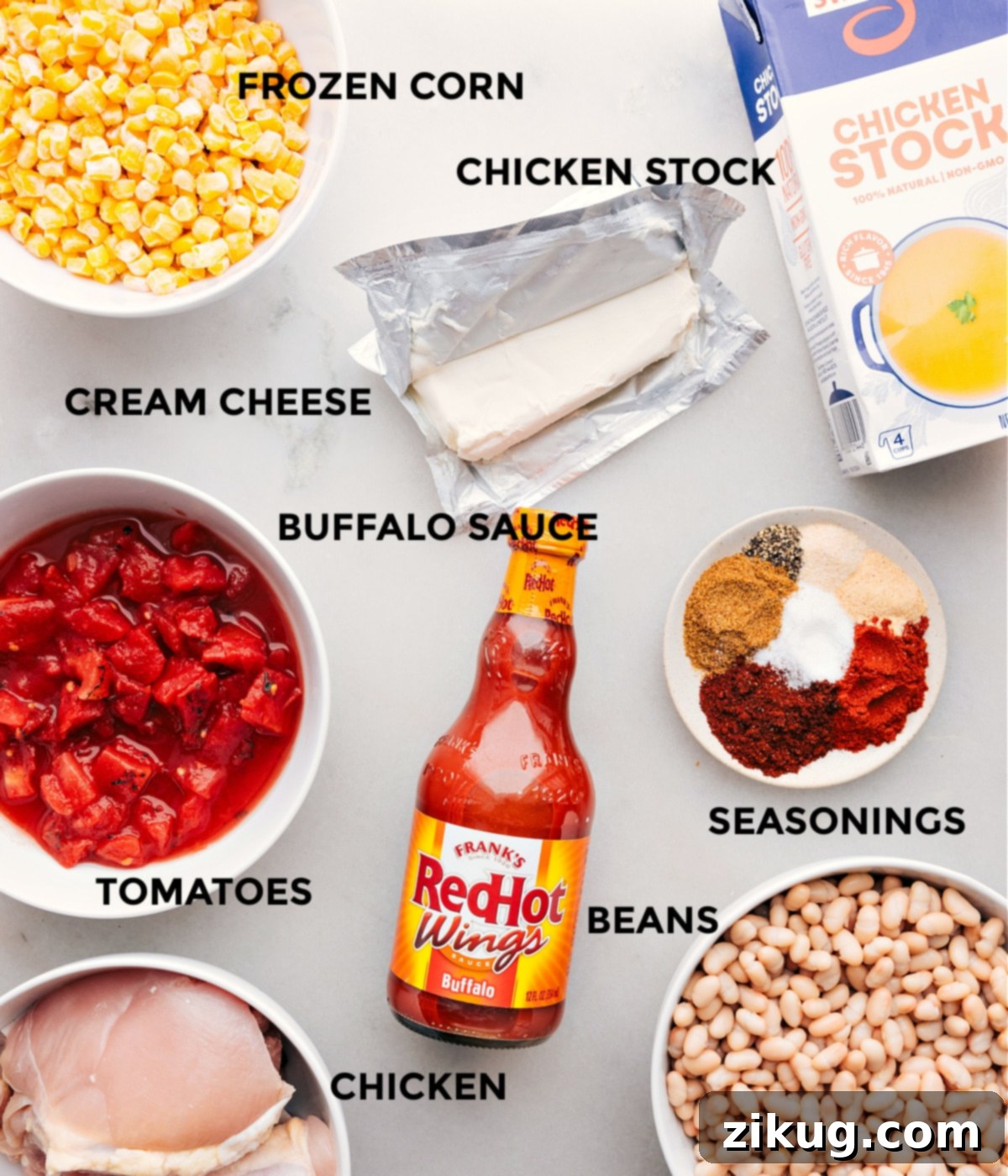 Delicious Ingredients Used In Buffalo Chicken Chili Various delicious ingredients including hot sauce, corn, beans, tomatoes, chicken stock, and chicken, ready for Buffalo Chicken Chili preparation.