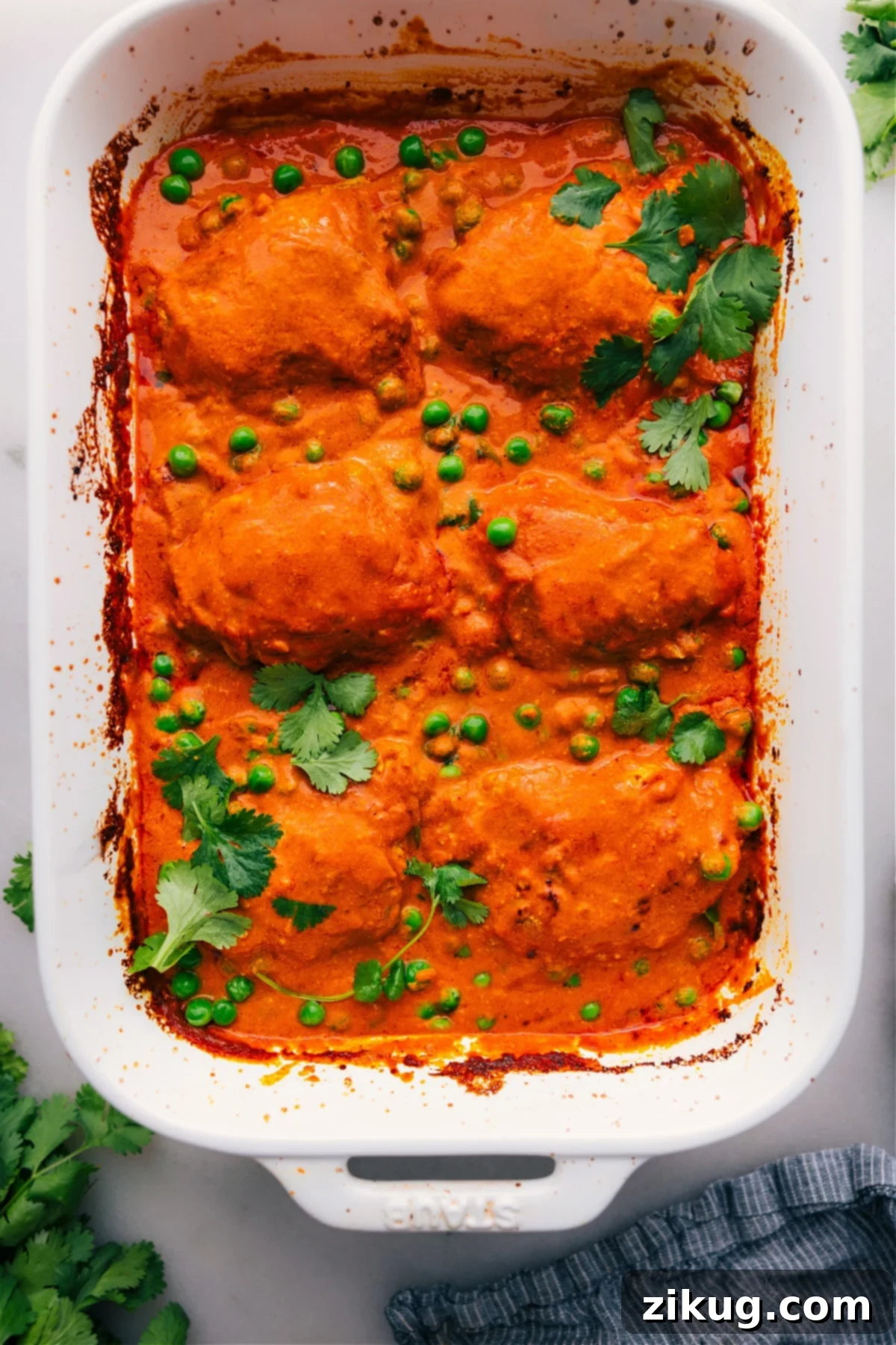 Irresistibly Hot and Delicious One-Pan Chicken Tikka Masala, Straight from the Oven A vibrant, one-pan Chicken Tikka Masala, freshly baked and simmering in its rich, creamy sauce, ready to be served.