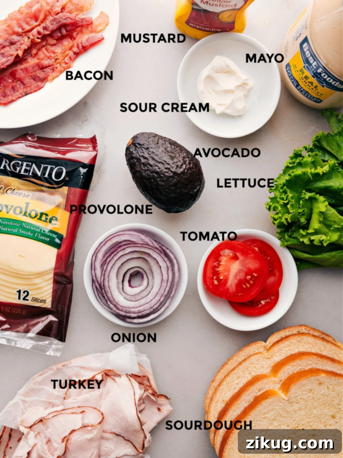 Ingredients used in the recipe including cheese, vegetables, meat, bacon, and mayo.