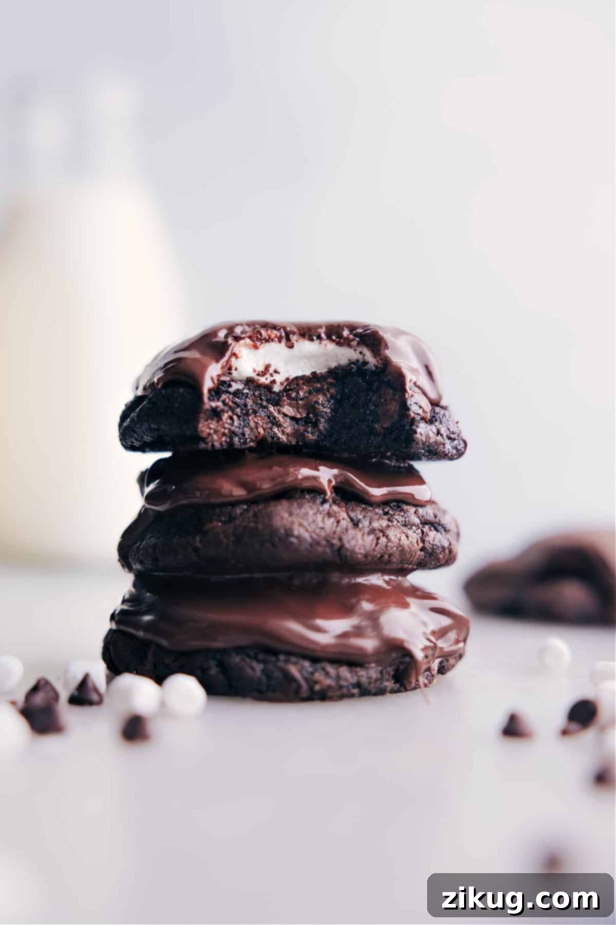 Delicious Chocolate Marshmallow Cookies stacked high on a plate, showcasing their rich chocolate base and fluffy marshmallow tops.