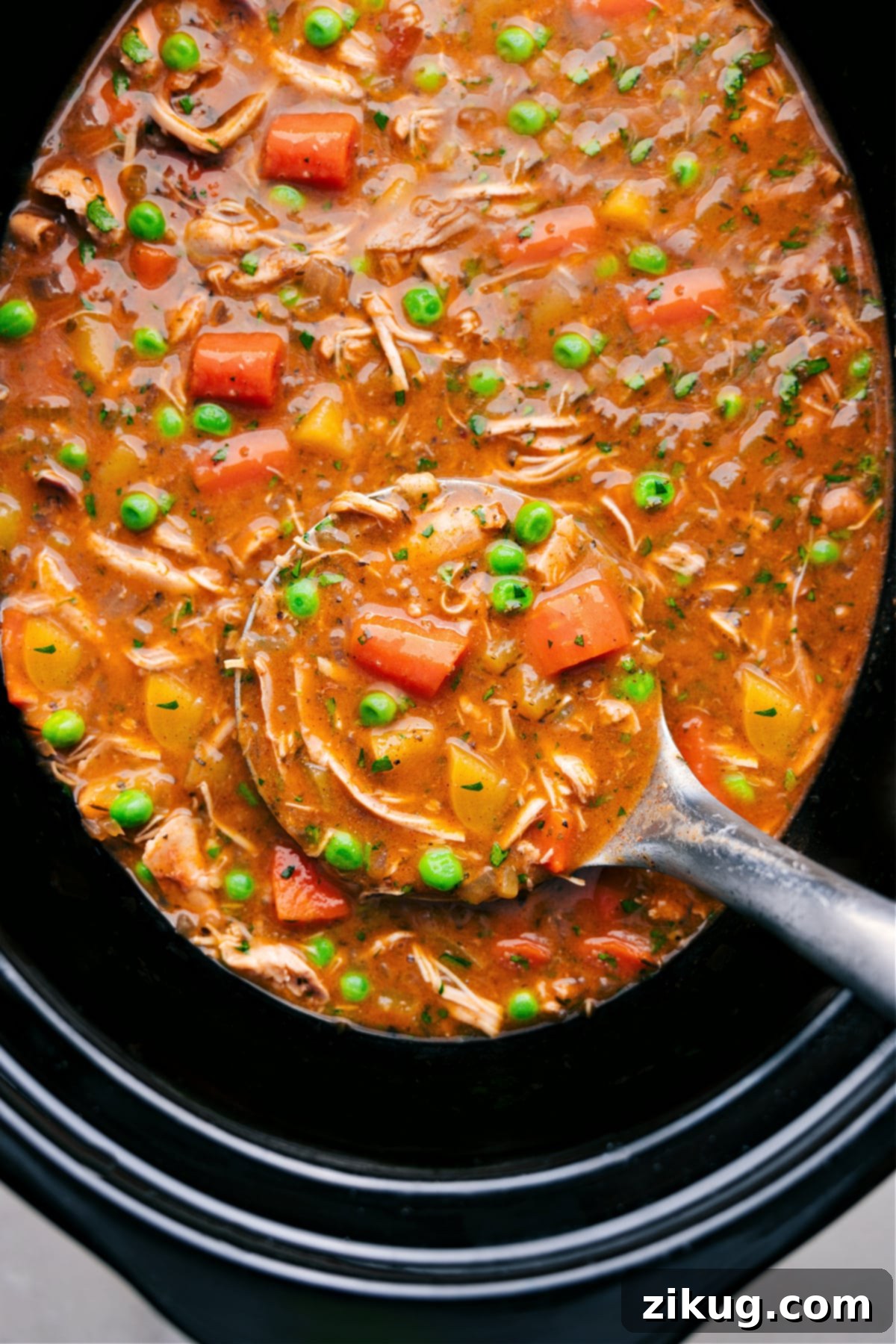The Best Crockpot Chicken Stew: A Hearty Slow Cooker Meal A bubbling Crockpot Chicken Stew, brimming with tender chicken, vibrant vegetables, and a thick, savory broth, ready to be served.