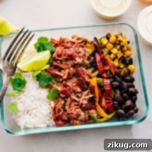 Salsa chicken crockpot prepped out for meal prep containers, ready for a healthy week.