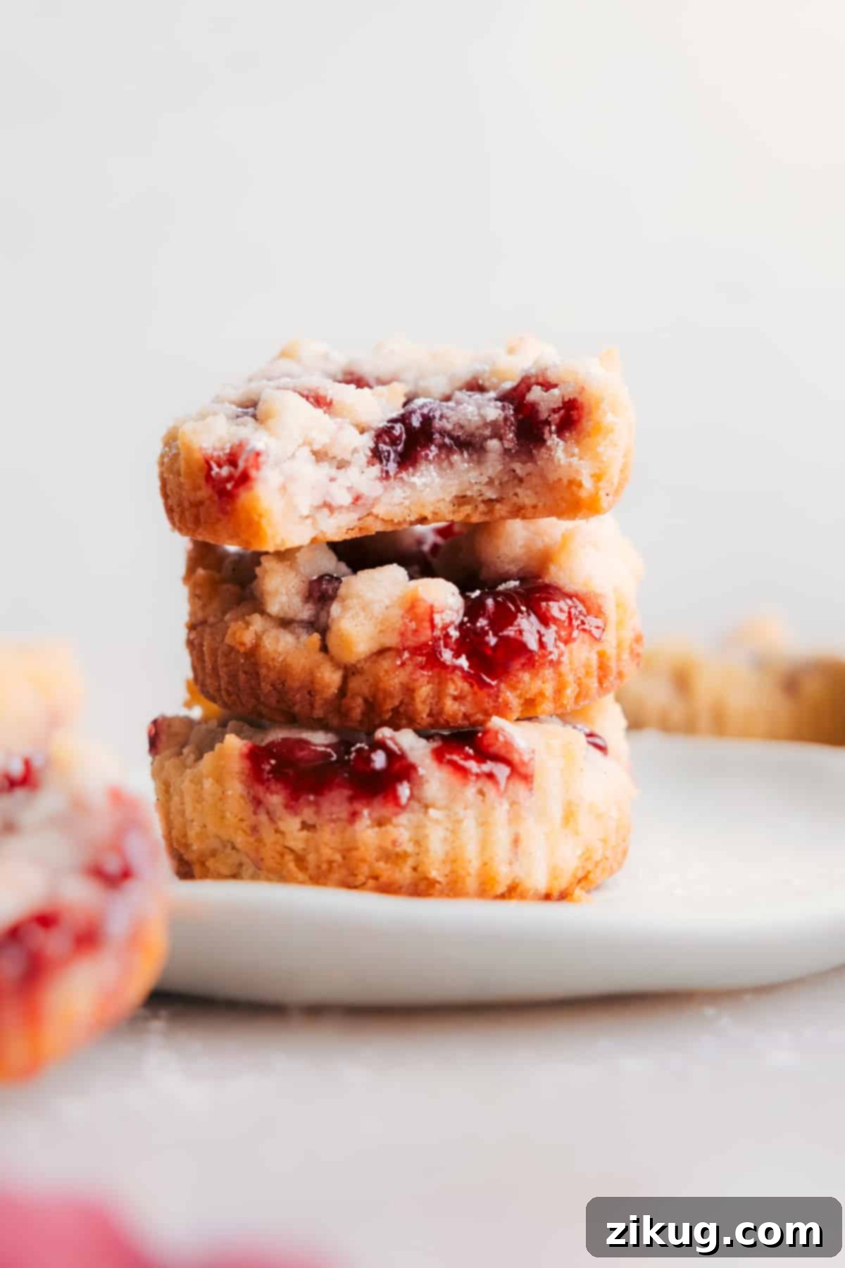 Costco's Raspberry Crumble Cookies make the best dessert! Stack of Costco's Raspberry Crumble Cookies on a plate