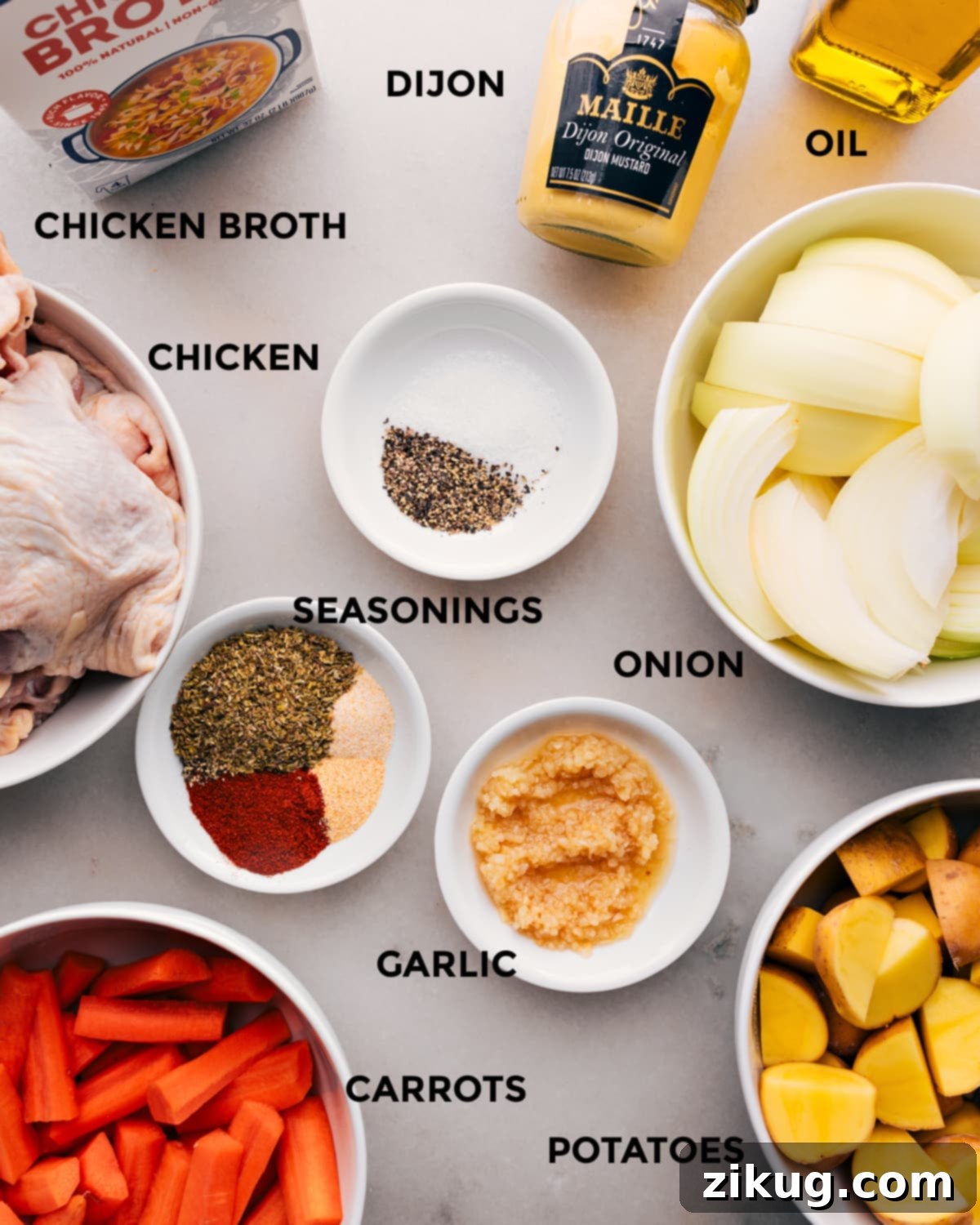 The Best One-Pan Chicken and Veggies Prep All the fresh ingredients for One-Pan Chicken and Potatoes, neatly laid out on a wooden board, ready for prep.