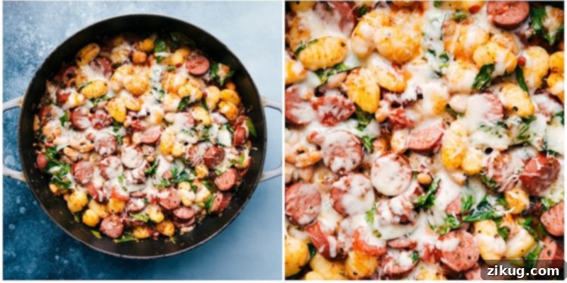 This White Bean Gnocchi combines aromatics, smoked sausage, savory white beans, tender gnocchi, fire-roasted tomatoes, and baby spinach for an explosion of flavor and textures! This nutritious and hearty meal can be prepared in less than 30 minutes and is made in one skillet! Recipe via chelseasmessyapron #dinner #comfort #comfortfood #best #delicious #easy #simple #onepan #whitebean #gnocchi Close-up of a serving of White Bean Gnocchi garnished with fresh parsley.