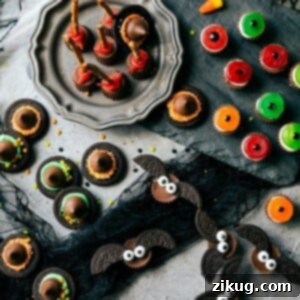 A tantalizing spread of easy Halloween treats, including Witch's Hats, Monster Eyeballs, Witch's Brooms, and Bat Bites, arranged for a festive display.