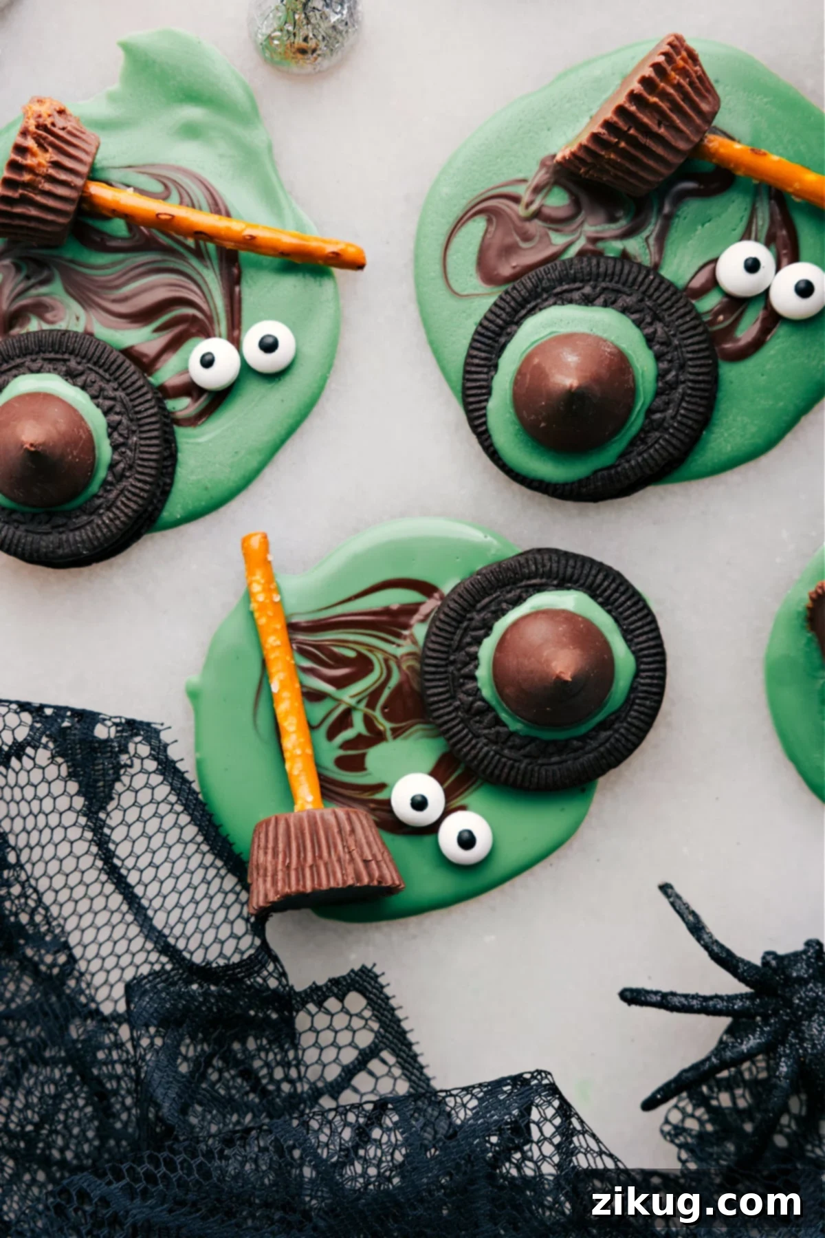 A beautiful and festive spread of all four easy Halloween treats: Monster Eyeballs, Witch's Hats, Witch's Brooms, and Bat Bites, artfully arranged on a serving tray.