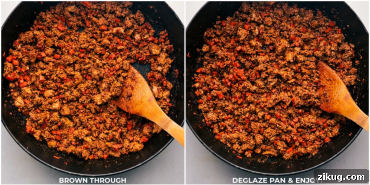 The ground turkey being browned through and cooked to perfection in a skillet.