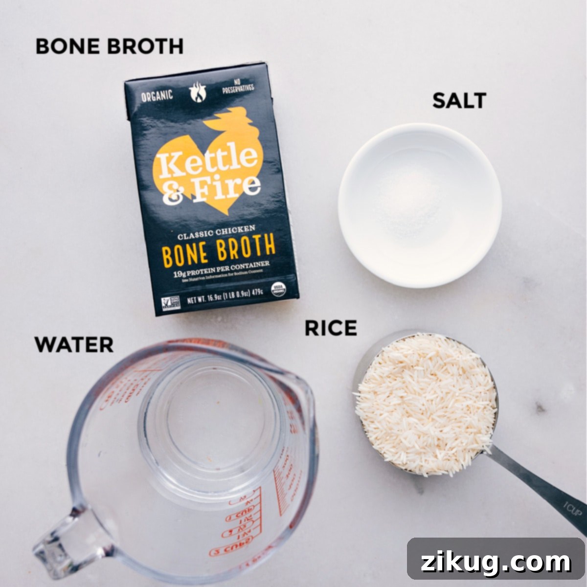 All the essential ingredients for Bone Broth Rice meticulously prepped out on a clean counter, ready for easy assembly and cooking.