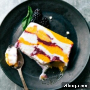 Vibrant Sorbet Terrine with layers of fruit, sorbet, and ice cream.