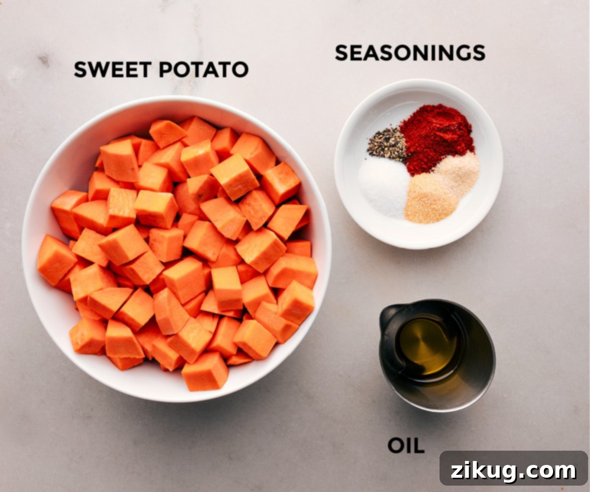 Ingredients for Air Fryer Sweet Potatoes All the ingredients for air fryer sweet potatoes, prepped and laid out on a cutting board.
