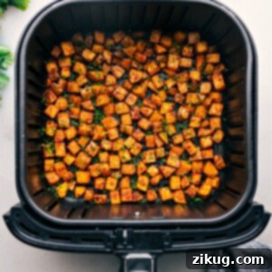 Crispy Air Fryer Breakfast Potatoes 3 Air Fryer Breakfast Potatoes freshly made, golden and ready to eat.