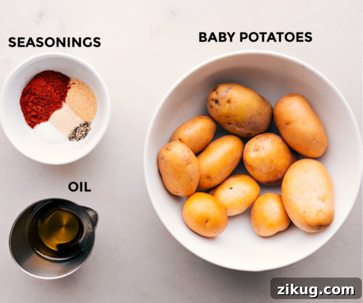 The Best Air Fryer Potatoes Ingredients All the ingredients used in this recipe prepped out for easy assembly, including baby potatoes, olive oil, and spices.