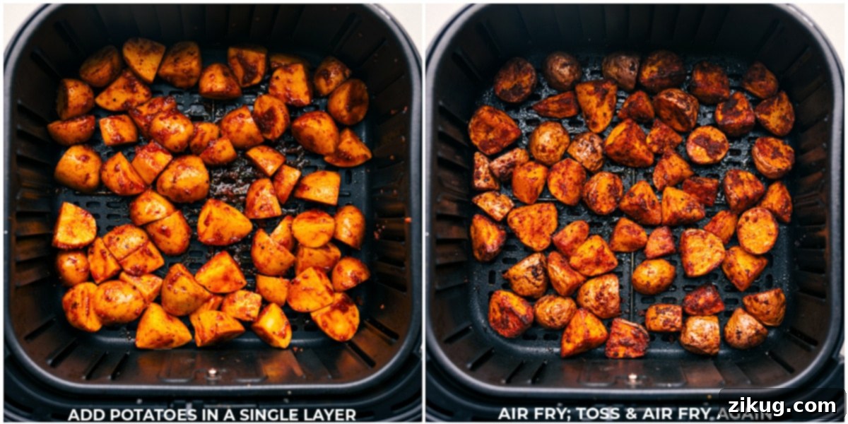 Delicious Air Fryer Potatoes Cooking The potatoes being cooked in a single layer in an air fryer basket to crispy perfection.