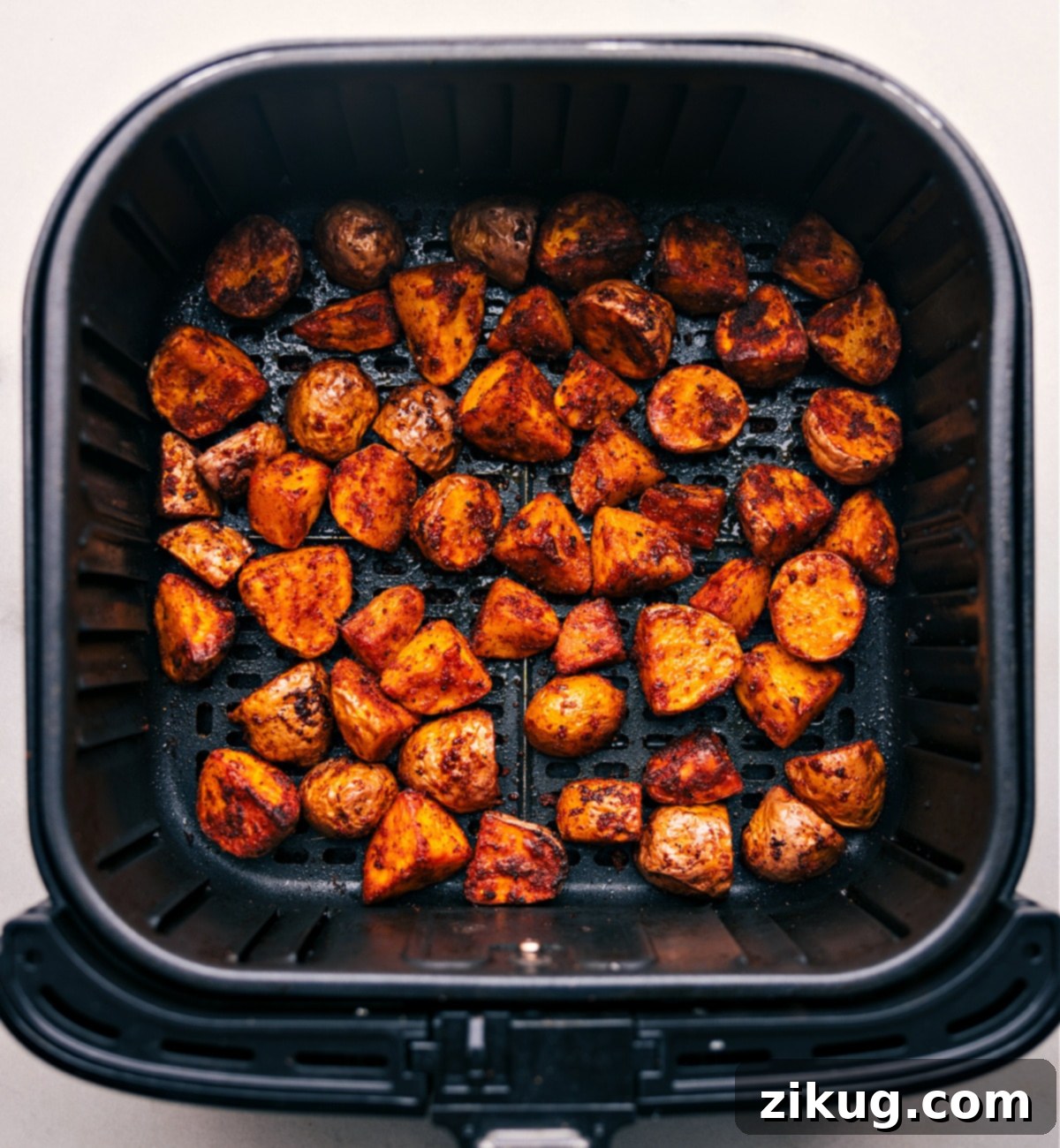 Our Obsession: Air Fryer Potatoes Air Fryer Potatoes right out of the air fryer, showing their golden crispness.