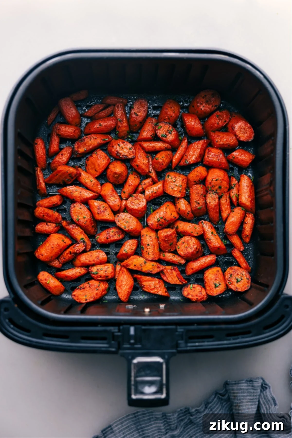 Our Favorite Air Fryer Carrots: Crispy & Tender Air Fryer Carrots fresh out of the air fryer, perfectly golden and crispy.