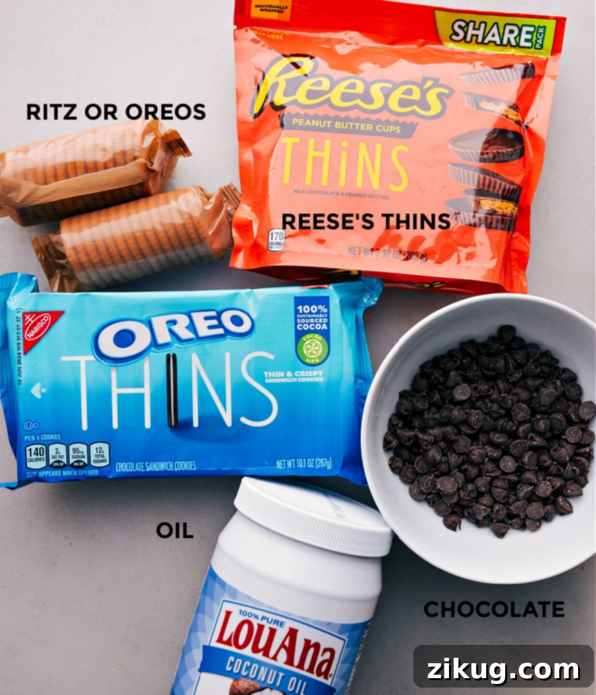 Ingredients for the Best Peanut Butter Ritz Oreos Photo showing the ingredients used in this recipe laid out for easy assembly, including crackers, peanut butter cups, and chocolate.
