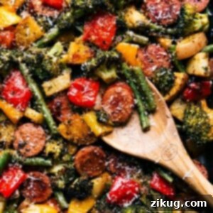 One-Pan Roasted Sausage and Veggies 3 Perfectly cooked and seasoned sheet pan sausage and vegetables, ready for serving.
