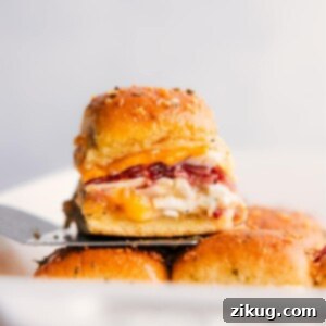 Zesty Ranch Chicken Bacon Bites 3 A perfect stack of Chicken Bacon Ranch Sliders, showcasing their golden crust and savory filling.