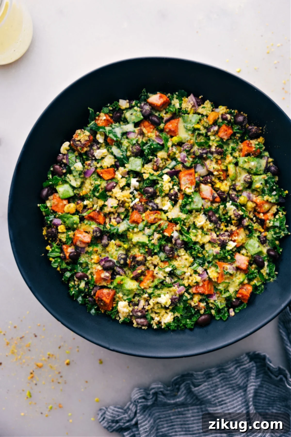 Delicious Kale Sweet Potato Salad Recipe A vibrant Kale Sweet Potato Salad in a rustic bowl, garnished and ready to be served and enjoyed.