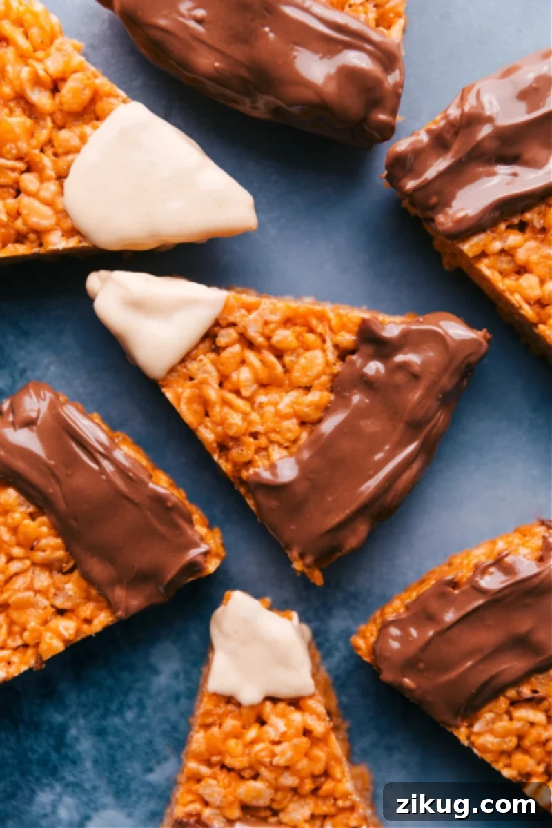Overhead shot of vibrant Candy Corn Krispie Treats arranged beautifully, ready for a fall celebration.