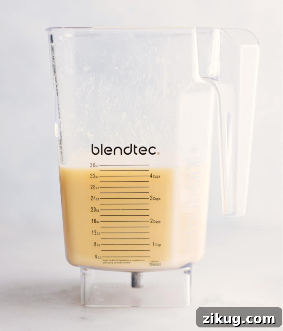The freshly blended Pina Colada, smooth and creamy, poured into a glass and ready for enjoyment.
