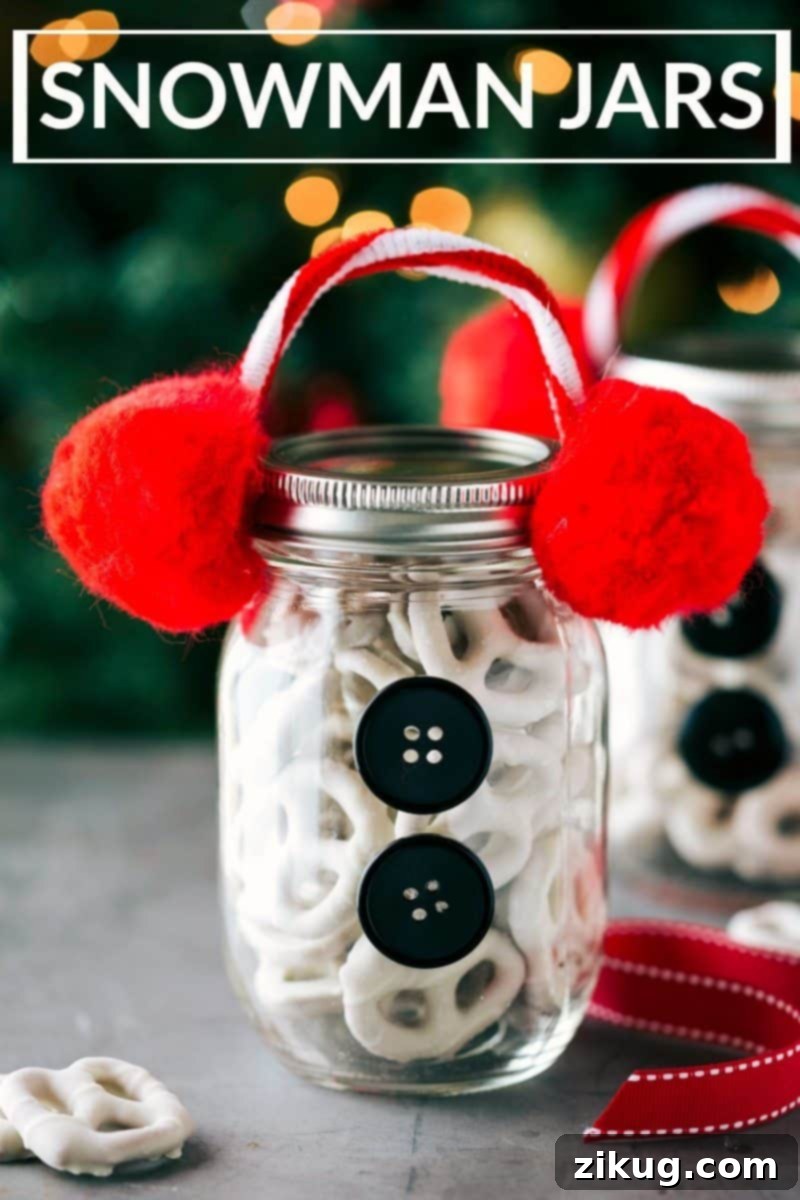 The cutest Christmas mason jar gift ideas, including a snowman jar. Image of charming snowman themed Christmas mason jar gifts filled with white chocolate covered pretzels, decorated with earmuff pipe cleaners and black buttons.