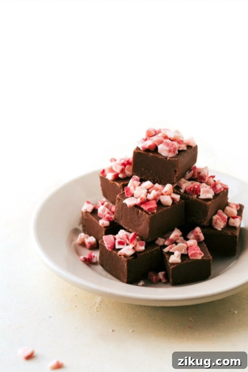 Foolproof Microwave Fudge: A simple and quick Christmas dessert recipe. Image of creamy and delicious foolproof microwave fudge, a quick and easy Christmas treat.
