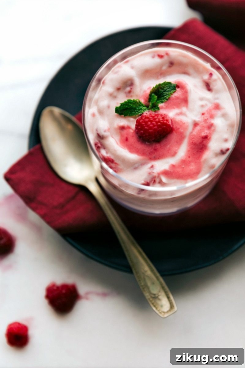 Up close overhead image of the raspberry fluff in a serving bowl, perfectly chilled and garnished, ready to be enjoyed.